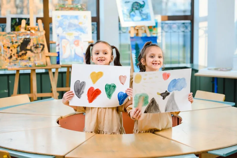 Students in a classroom sharing artwork they have colored